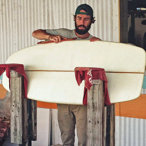 An innovative "craftsman by the sea," Kearins puts some touches on a hand shaped custom cruising board.